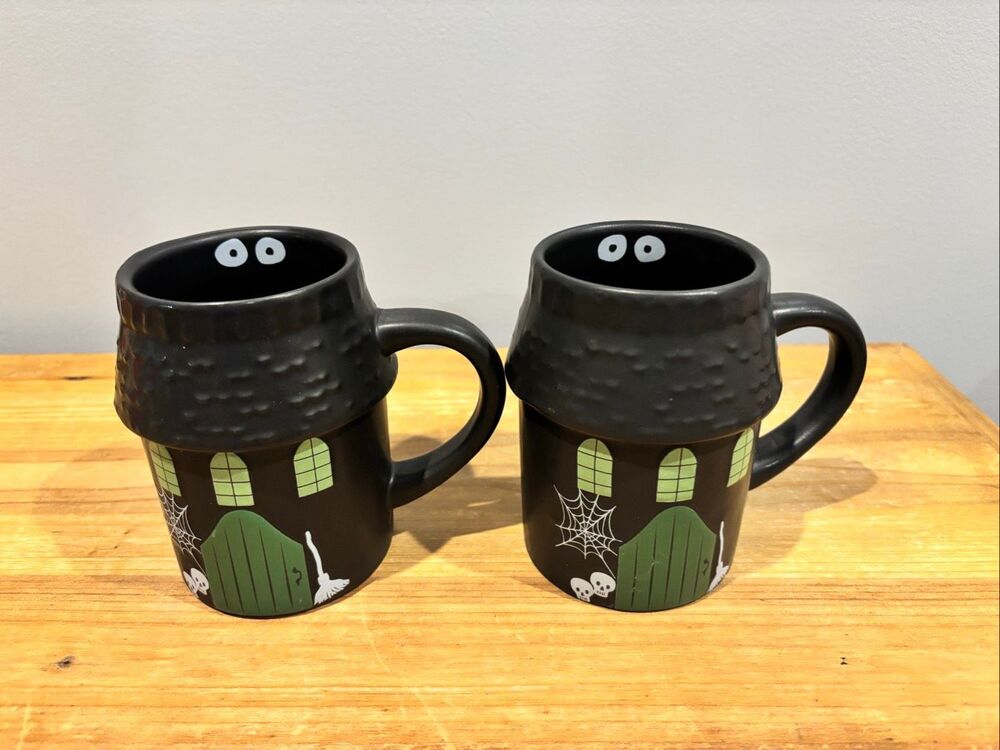 Hyde and Eek haunted house Halloween coffee cups
